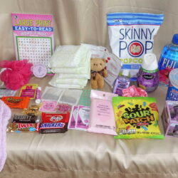 Premium monthly period box products displayed with feminine hygiene pads and indulgent healthy snacks.