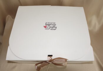 Close-up of a stylish feminine box used to hold all of the deluxe monthly menstrual box products.