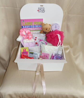 Menstrual care package with feminine essential pads, spa worthy products, and sweet delectables.