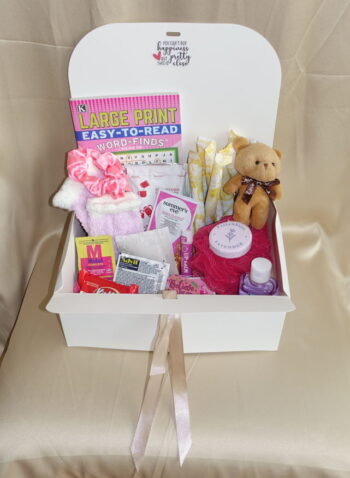 Menstrual care package with feminine essential tampons, spa worthy products, and sweet delectables.