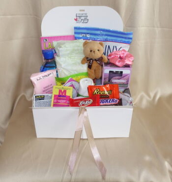 Period care package with feminine essential pads, spa worthy products, and sweet delectables.
