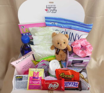 Period subscription box with feminine pads, delicious healthy snacks, and soothing comfort items in a stylish box.