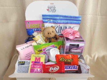Period subscription box with feminine tampons, delicious healthy snacks, and soothing comfort items in a stylish box.