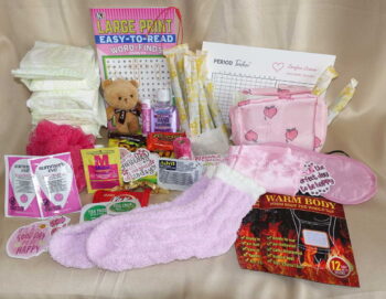 1st period kit products displayed with feminine hygiene pads, tampons, soothing comfort items, and indulgent healthy snacks.
